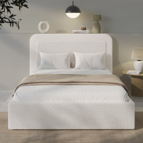 White upholstered bed with beige blanket in a modern bedroom setting
