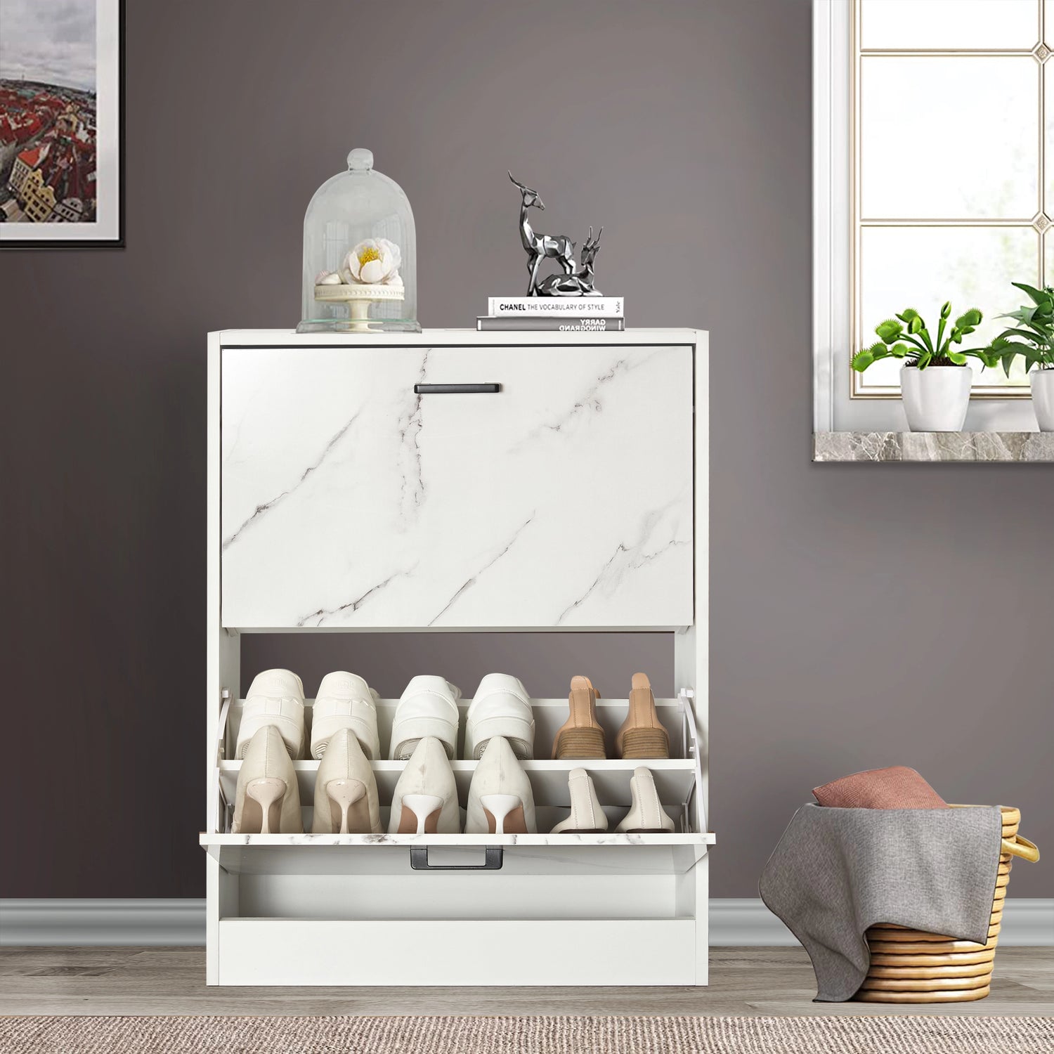 White marble 12 pair shoe storage cabinet with lower pull-down drawer open and boots neatly placed inside.