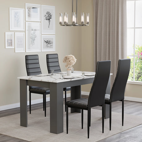 a sleek dining room table and chairs set with white marble finish and black leather chairs in minimal dining room