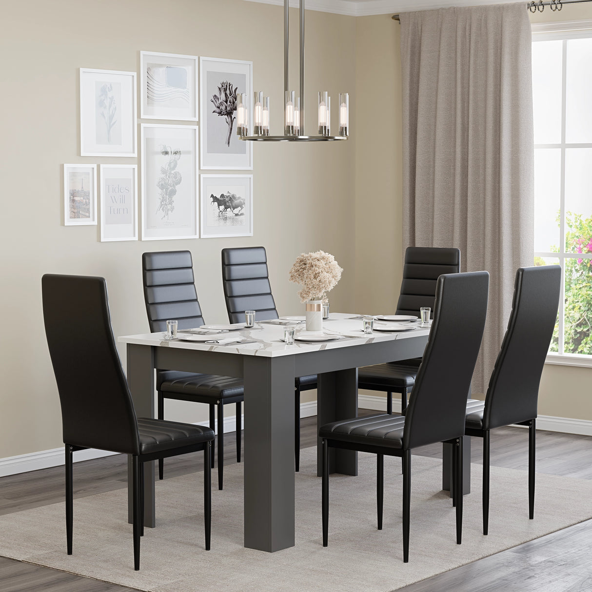 spacious marble dining room table and chairs  for 6 people with black seats in airy room with neutral tones