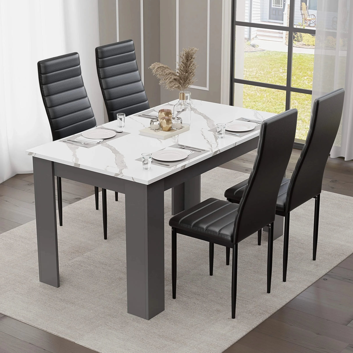 modern small dining table and chairs set featuring white marble top with grey base and black chairs