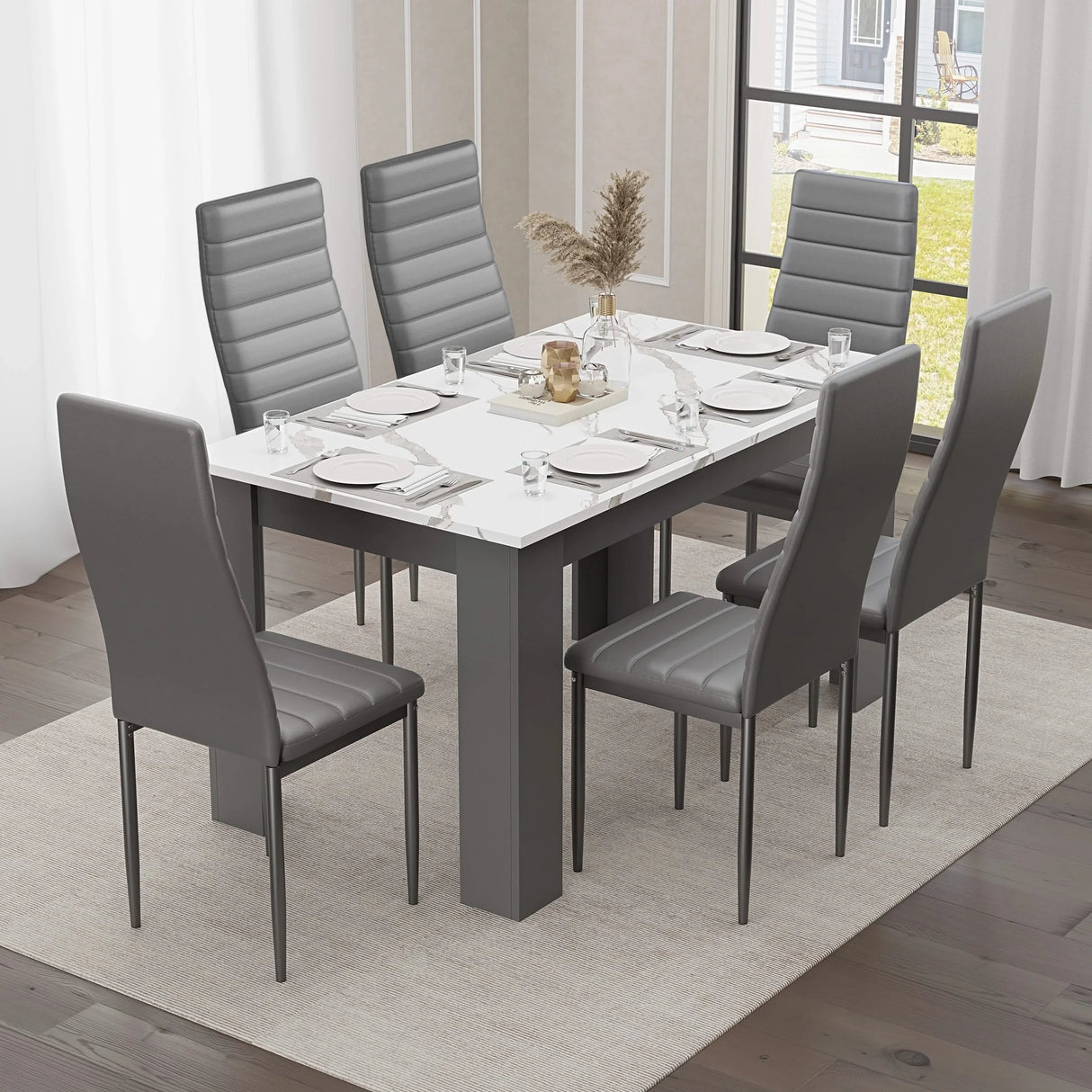 elegant marble dining table and 6 chairs set in grey and white with black leather chairs, modern vibe