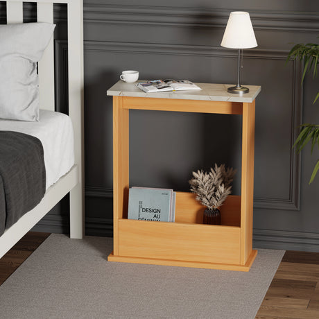 Slim side table for living room being used as bedroom nightstand with books and night lamp; pine base and grey marble top.