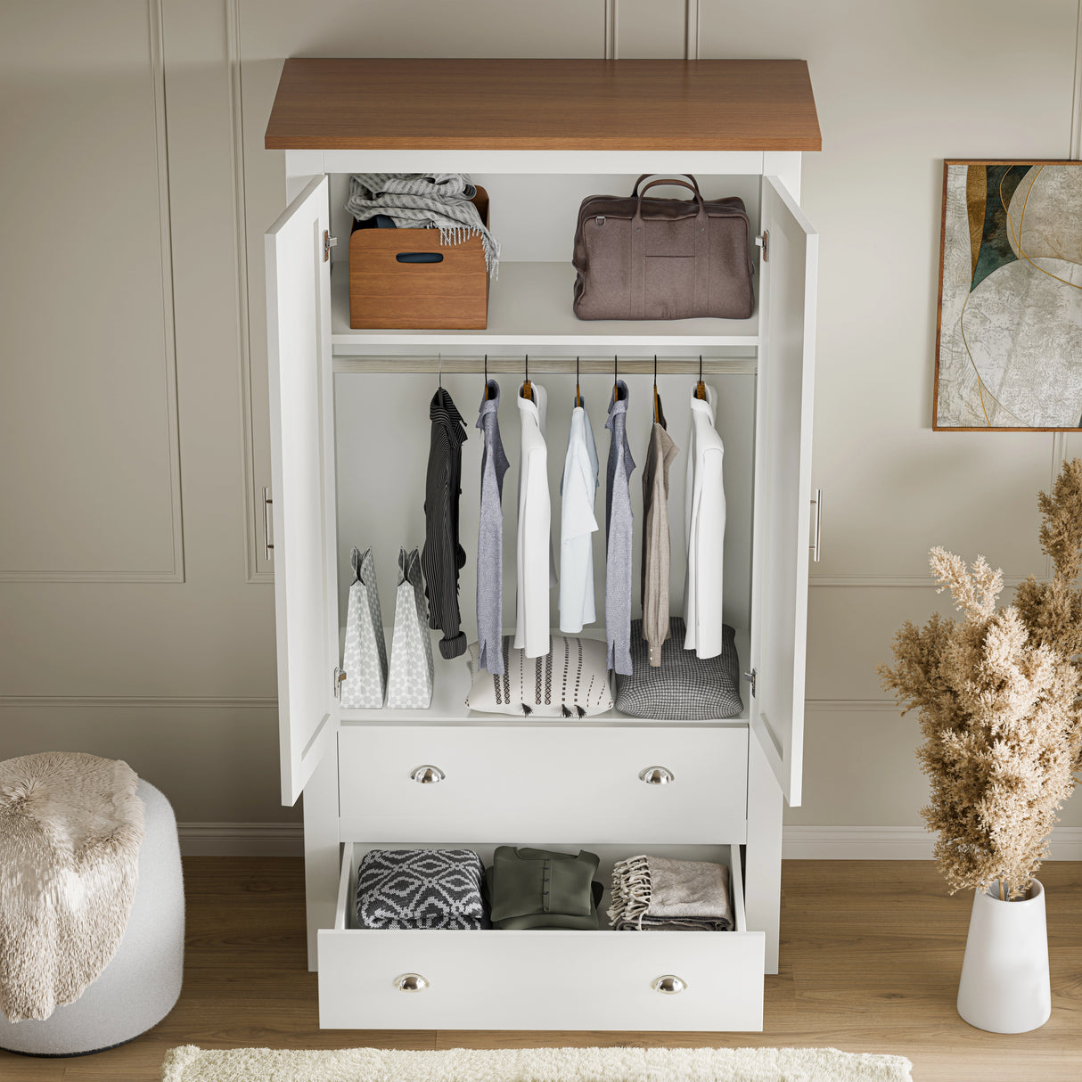 interior view of white shaker double wardrobe with drawers showing shelves, rail, and drawers from the high angle