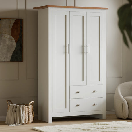 Buy Shaker Triple Wardrobe With Shelves And Drawers in white finish featuring 3 doors, 2 drawers, and a wooden top. Ideal for modern bedroom storage.