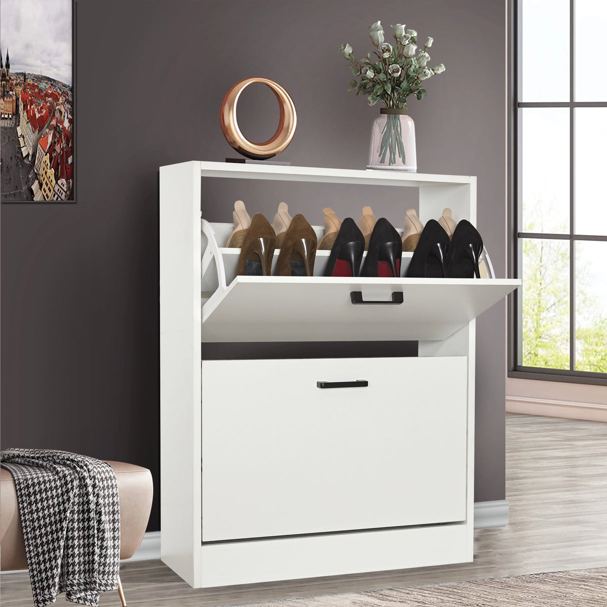 White shoe cabinet 2 door with top pull-down drawer open; decor and plant sit neatly on the cabinet top.