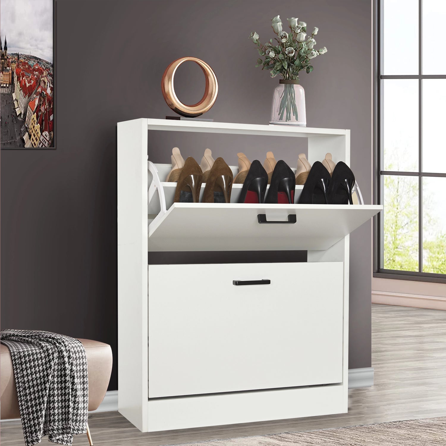 White shoe cabinet 2 door with top pull-down drawer open; decor and plant sit neatly on the cabinet top.