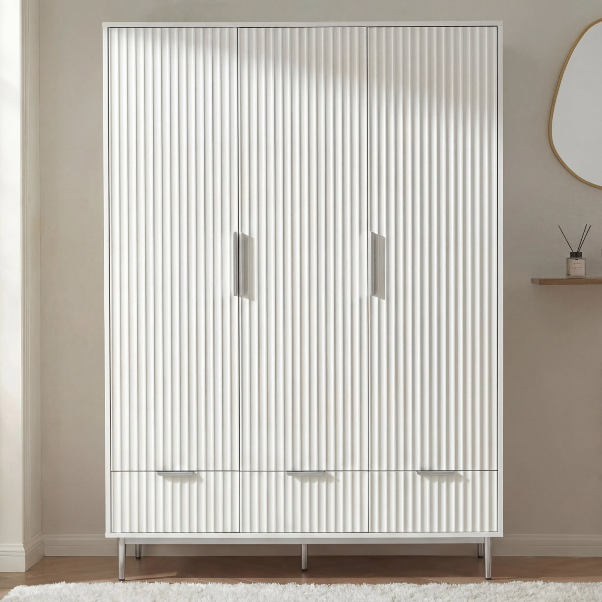 Front elevation of white 3 door wardrobe with integrated drawer storage and silver metal handles