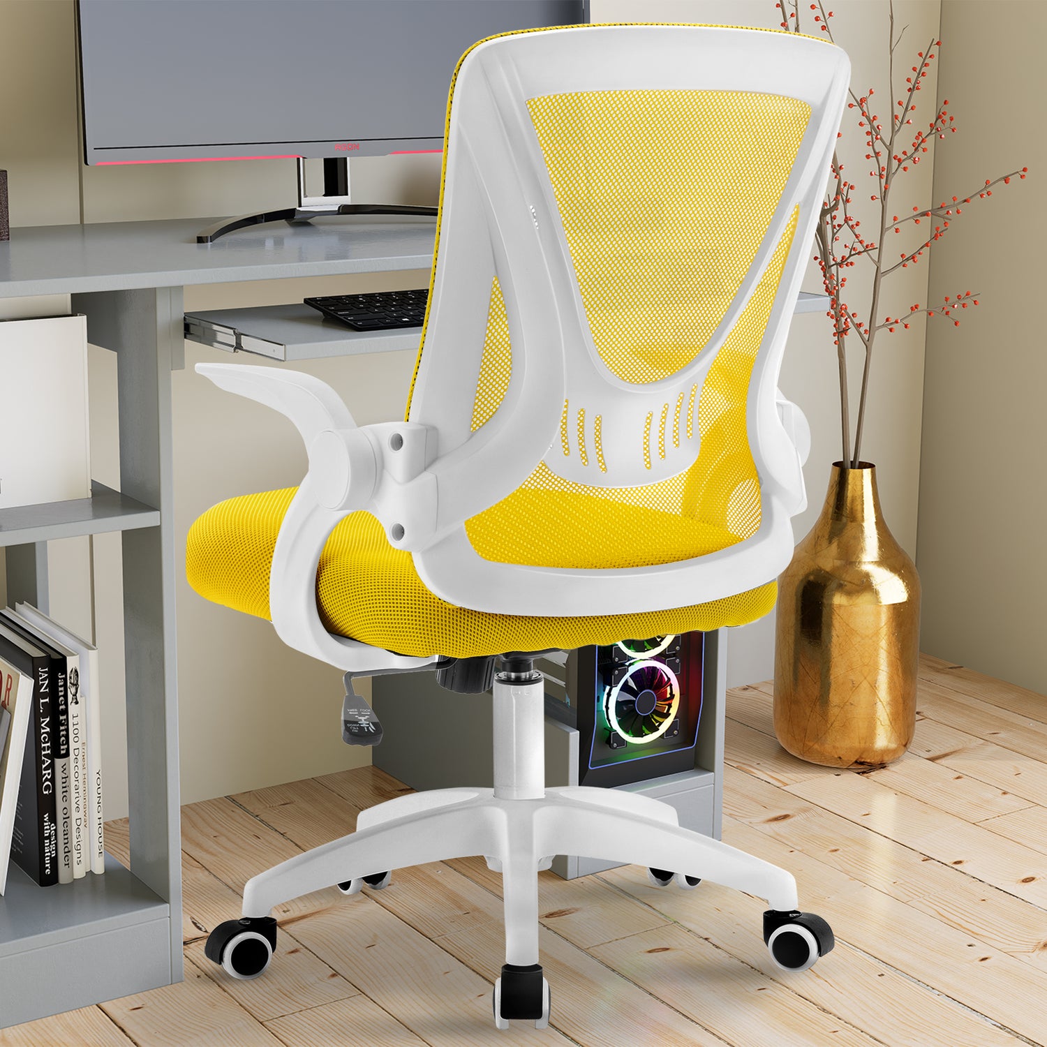 Yellow office chair with mesh backrest, offering ergonomic support and comfort near your PC workstation.