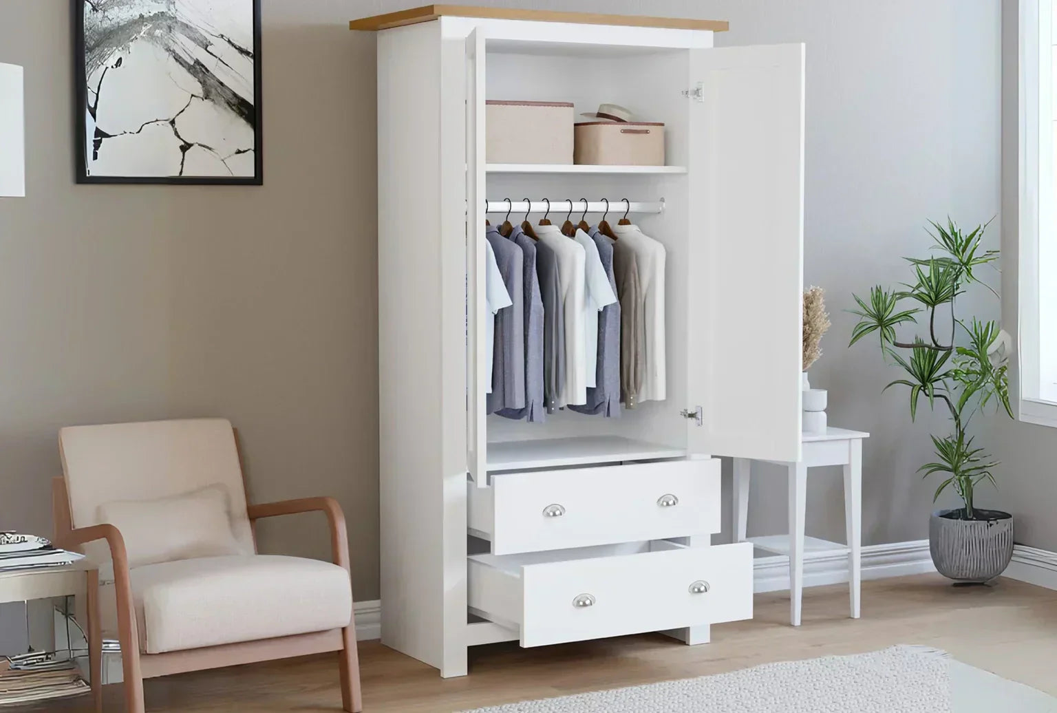 Open white shaker-style 2-door wardrobe with drawers, shown in a bedroom while airing out to prevent moisture build-up.