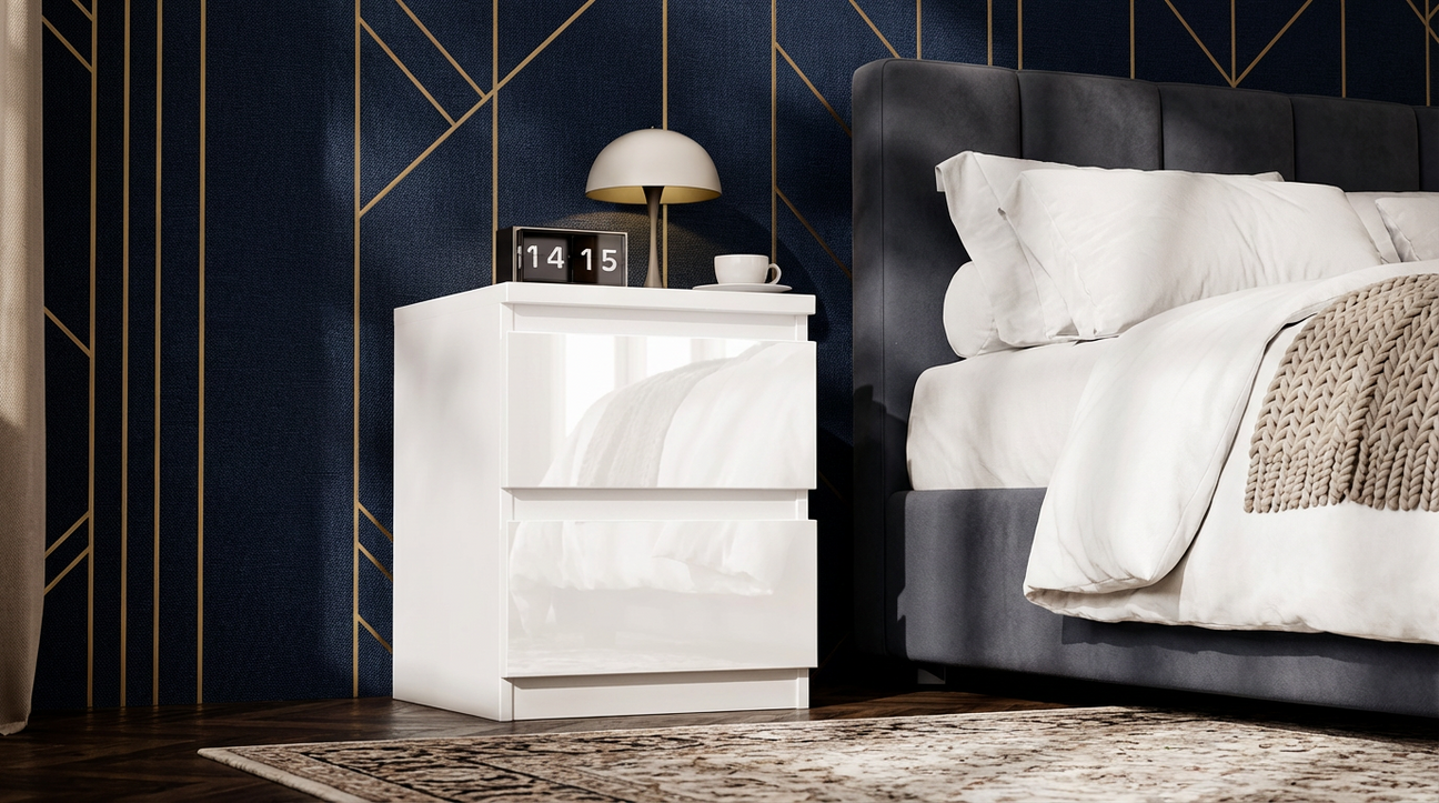Modern bedside table in glossy white finish placed against a blue wall in a bedroom 