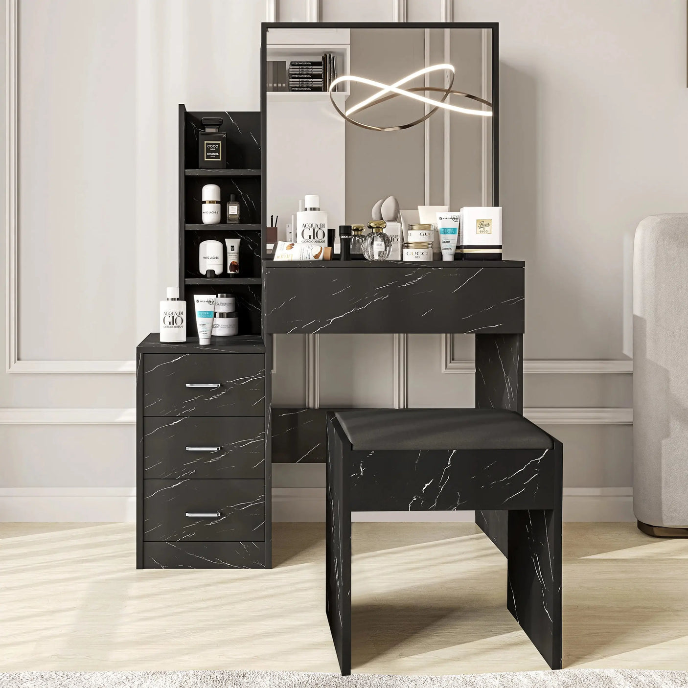 Modern black vanity makeup table with mirror and stool. Features sleek marble-style drawers and organized shelving for bedroom use.