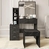 Modern black vanity makeup table with mirror and stool. Features sleek marble-style drawers and organized shelving for bedroom use.