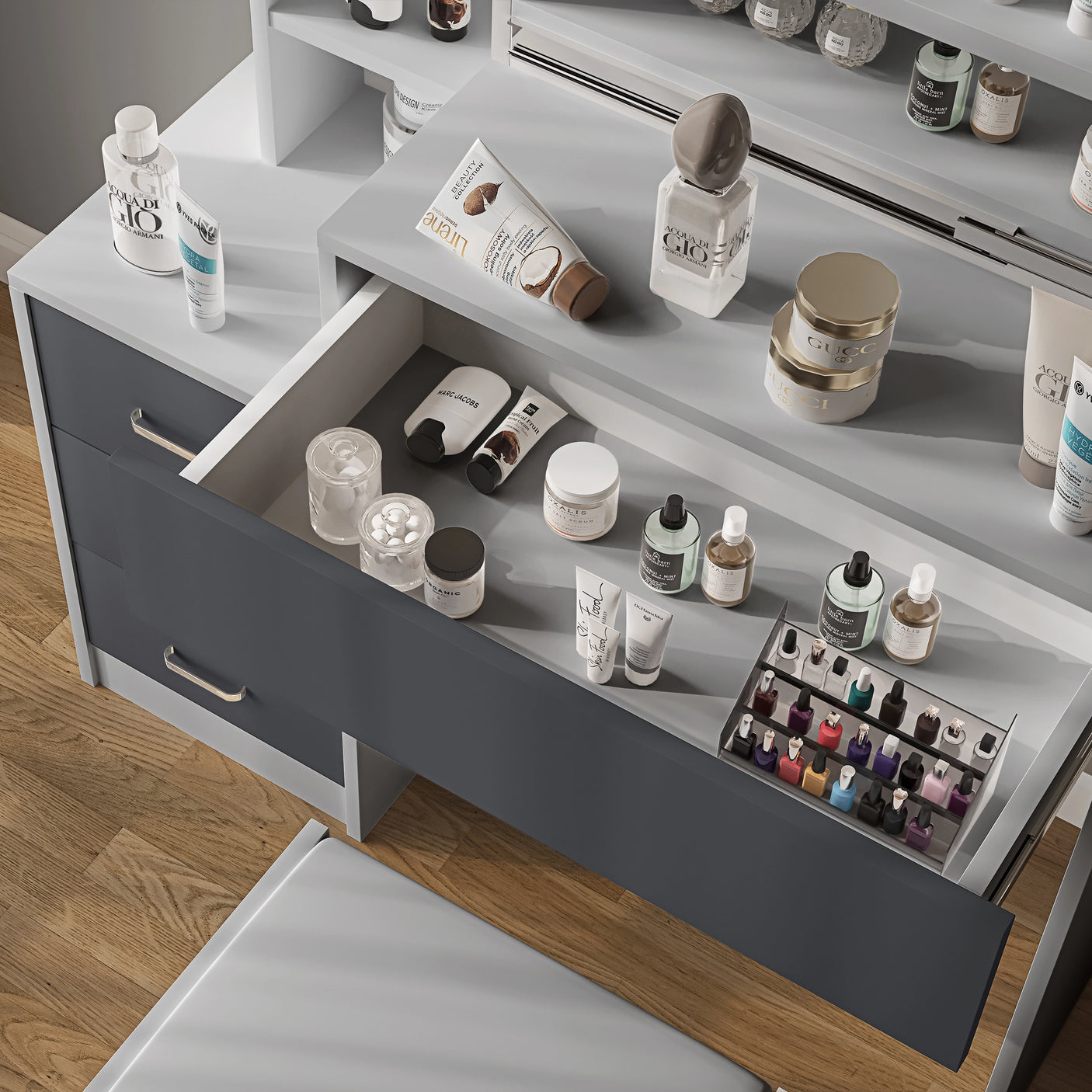 Close-up of grey and light grey vanity table drawer with cosmetics. Organised storage for beauty products in a modern bedroom setup.