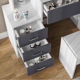 White and grey dressing table drawers open with cosmetics. Features organized storage and modern design for bedroom vanity use.