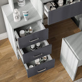 Grey and light grey dressing table drawers open with cosmetics. Features organised storage and modern design for bedroom vanity use.