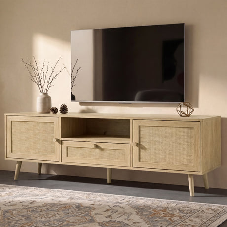 [Oak Effect] Wovena TV unit in a wider lifestyle view beneath a wall-mounted TV on a patterned rug, with a ceramic vase and gold geometric ornament on top