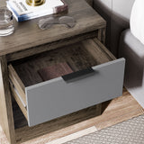 Skova 3 Piece Bedroom Furniture Set bedside table with open drawer in grey and wood finish, showing storage space and modern handle design.