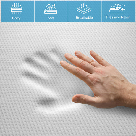 hand gently pressing into an 18 cm memory foam mattress showing plush softness and motion-isolating support