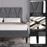 Velvet upholstered bed frame in dark grey with adjustable metal button-tufted headboard, rock-solid wooden slat support, and sturdy black legs.