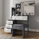 Contemporary grey vanity makeup table with marble drawers and mirror. Features organized storage and a matching cushioned stool for bedroom decor.