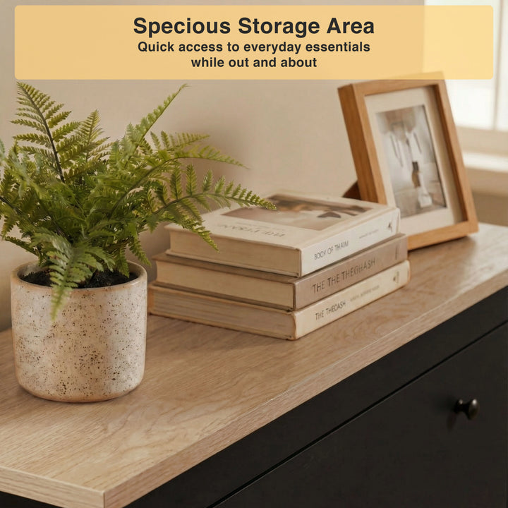 [Black] Detail of natural oak finish countertop used as display area with plant and stacked books