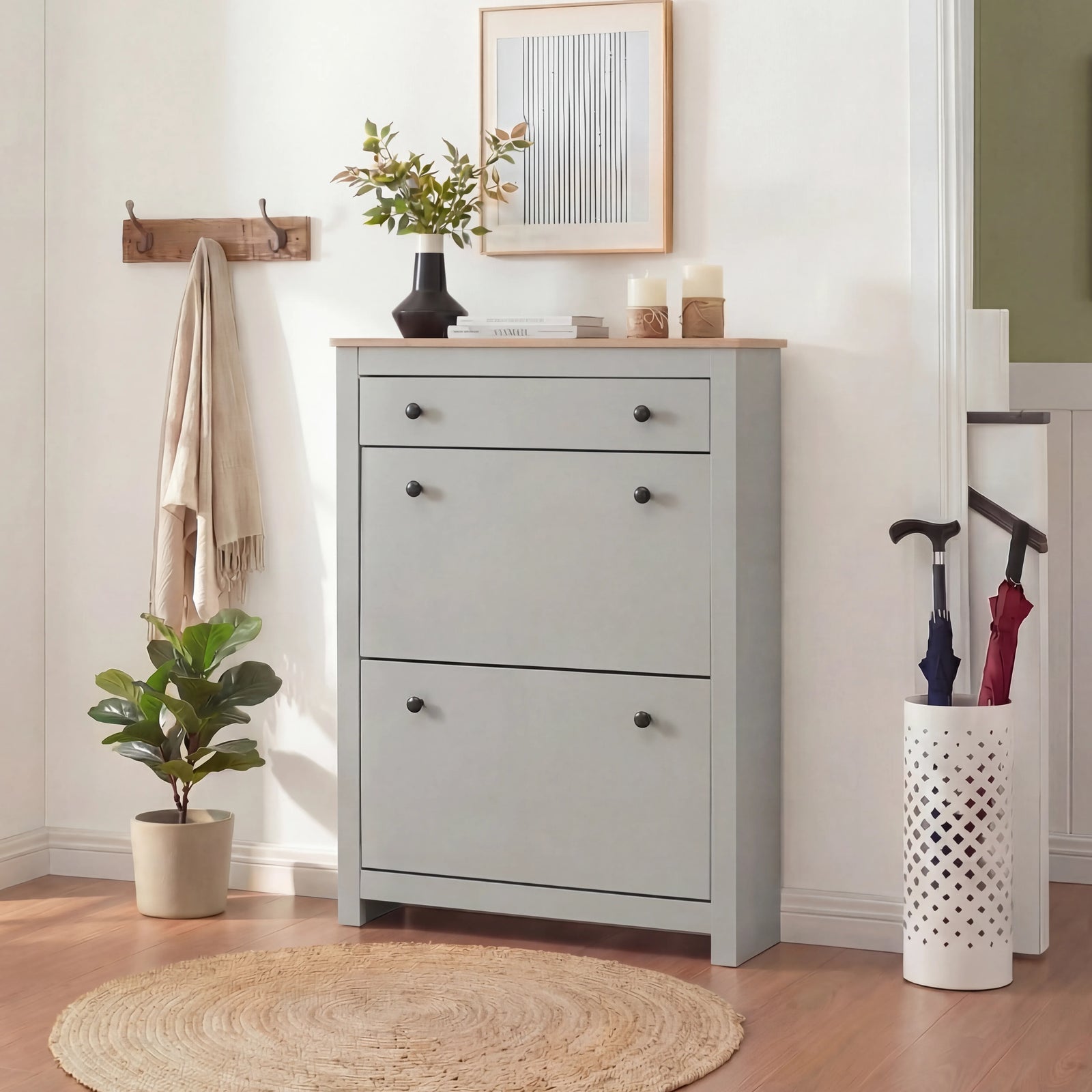 [Grey] Shoe cabinet with all compartments shut styled in hallway with plant and umbrella stand