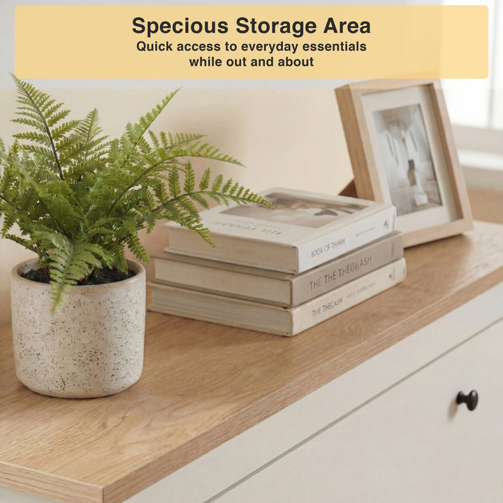 [White] Oak-effect top surface styled with potted fern books and photo frame for hallway display
