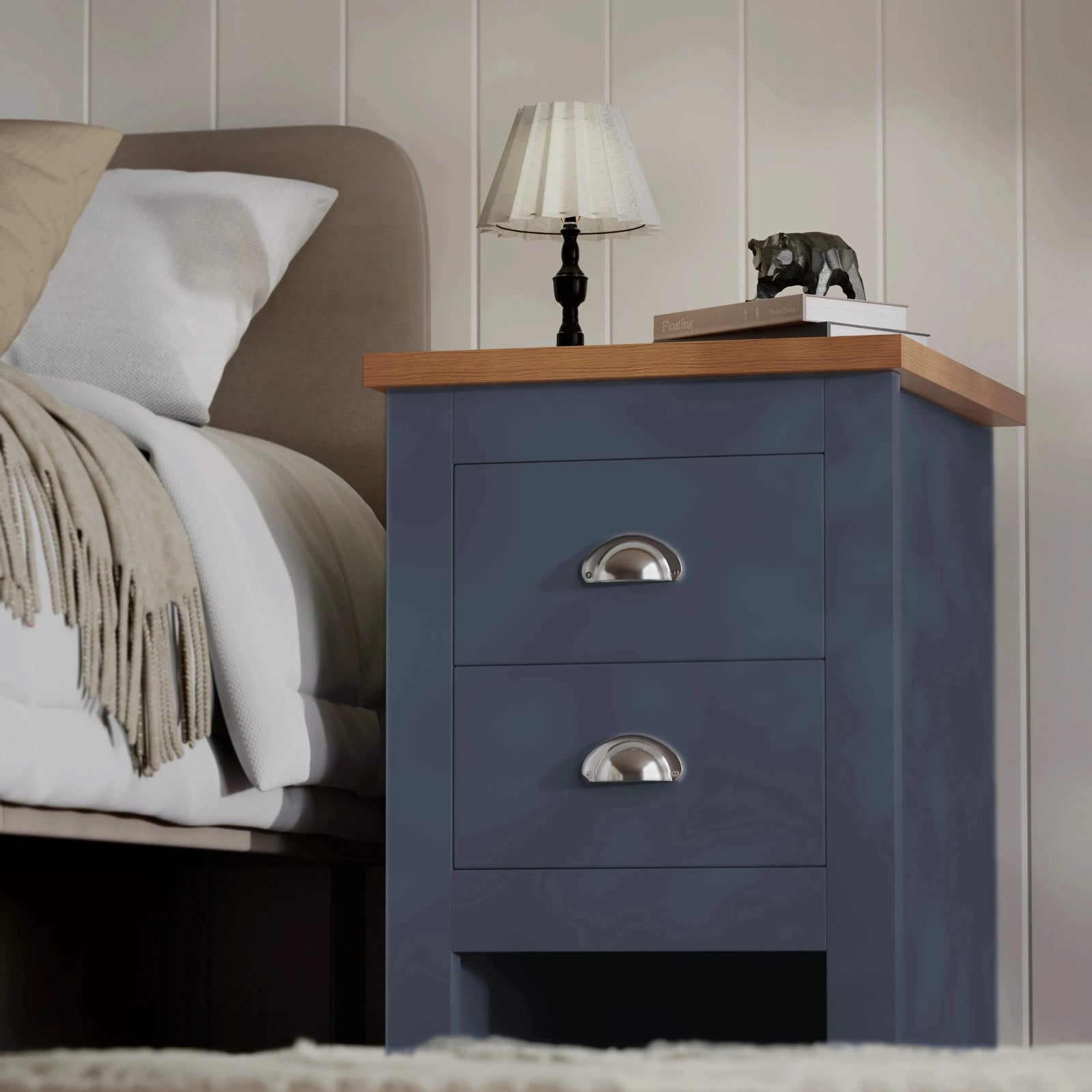 [Blue] Blue bedside table pair shown beside bed with throw, oak top styled with shaded lamp, chrome cup handles