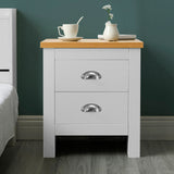 White 2-drawer bedside table with oak top, modern design, ideal for bedroom storage.