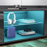 Modern entertainment console with shelves displaying books, a gaming console, and headphones.