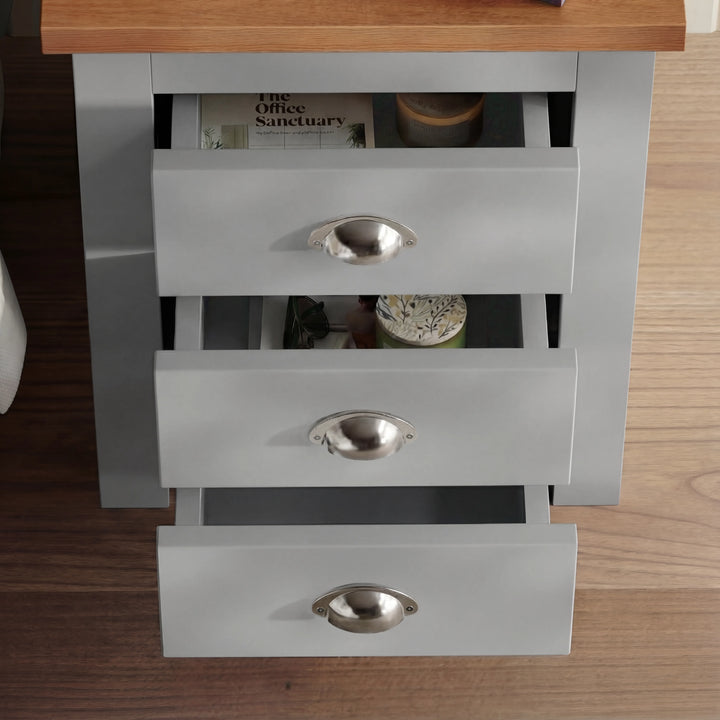 [Grey] Overhead view of grey shaker bedside with all 3 drawers cascade-open showing magazine and bowl