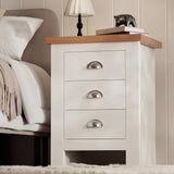[White] Side angle of shaker nightstand showing solid construction and oak top with decorative items