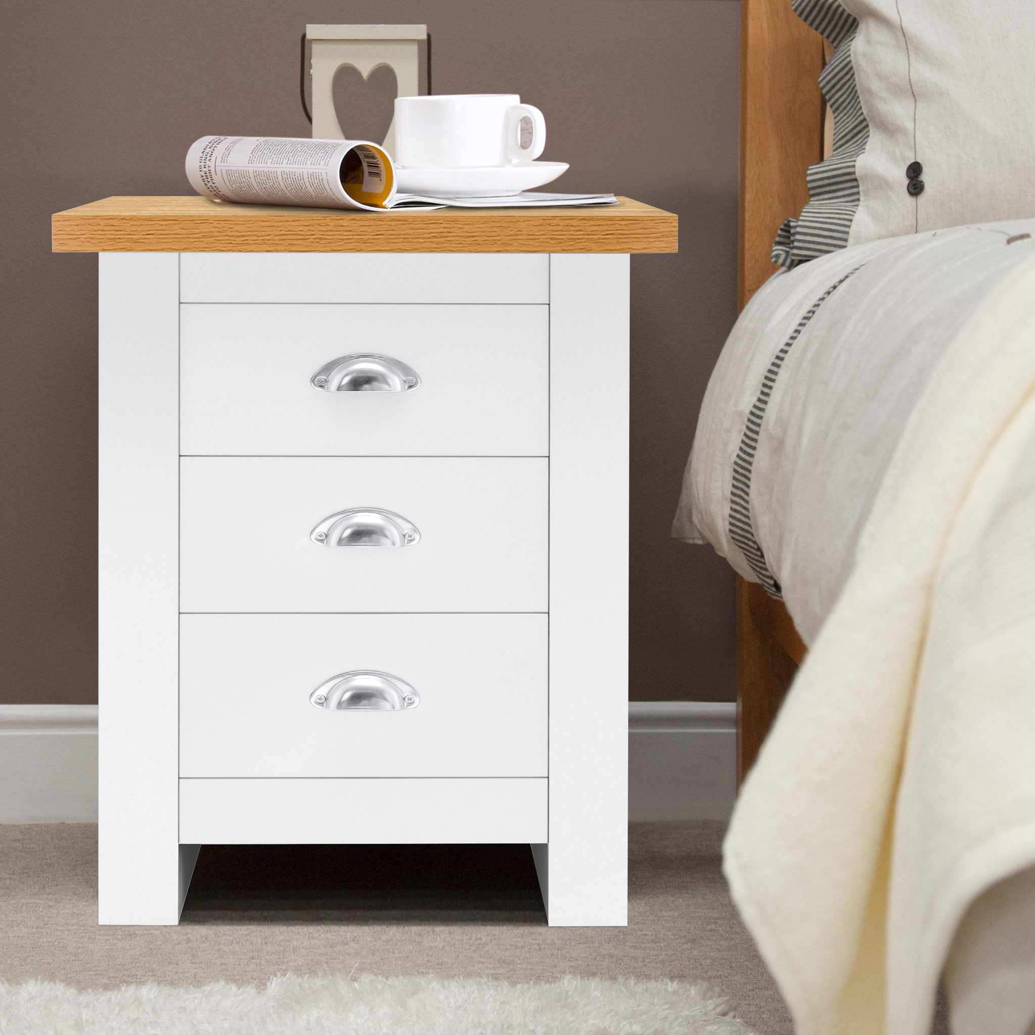 White 3 drawer bedside table with oak top, modern and functional bedroom furniture.