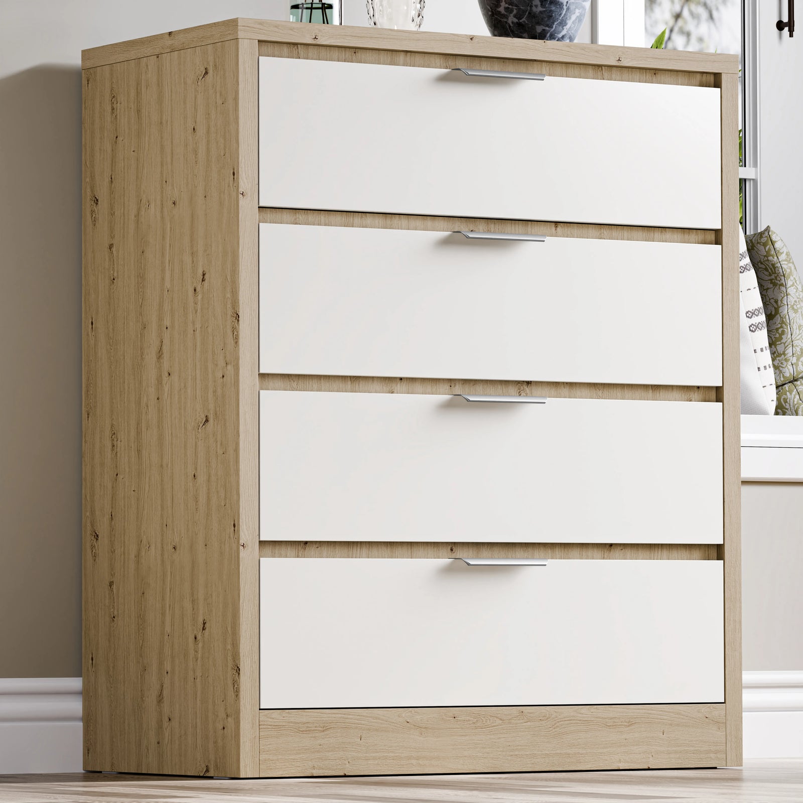 [Oak+White] Skova 4 drawer chest of drawers in oak and white, angled view next to a tall wicker basket