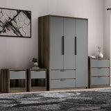 Skova 4 Piece Bedroom Furniture Set with 3-door wardrobe, chest of drawers, and 2 bedside tables in grey wood finish. Ideal for modern UK bedrooms.