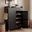 [Black] Hallway black shoe storage cabinet with one slatted door swung open to reveal stacked shoe shelves