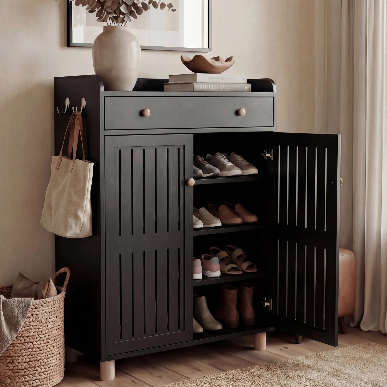 [Black] Hallway black shoe storage cabinet with one slatted door swung open to reveal stacked shoe shelves