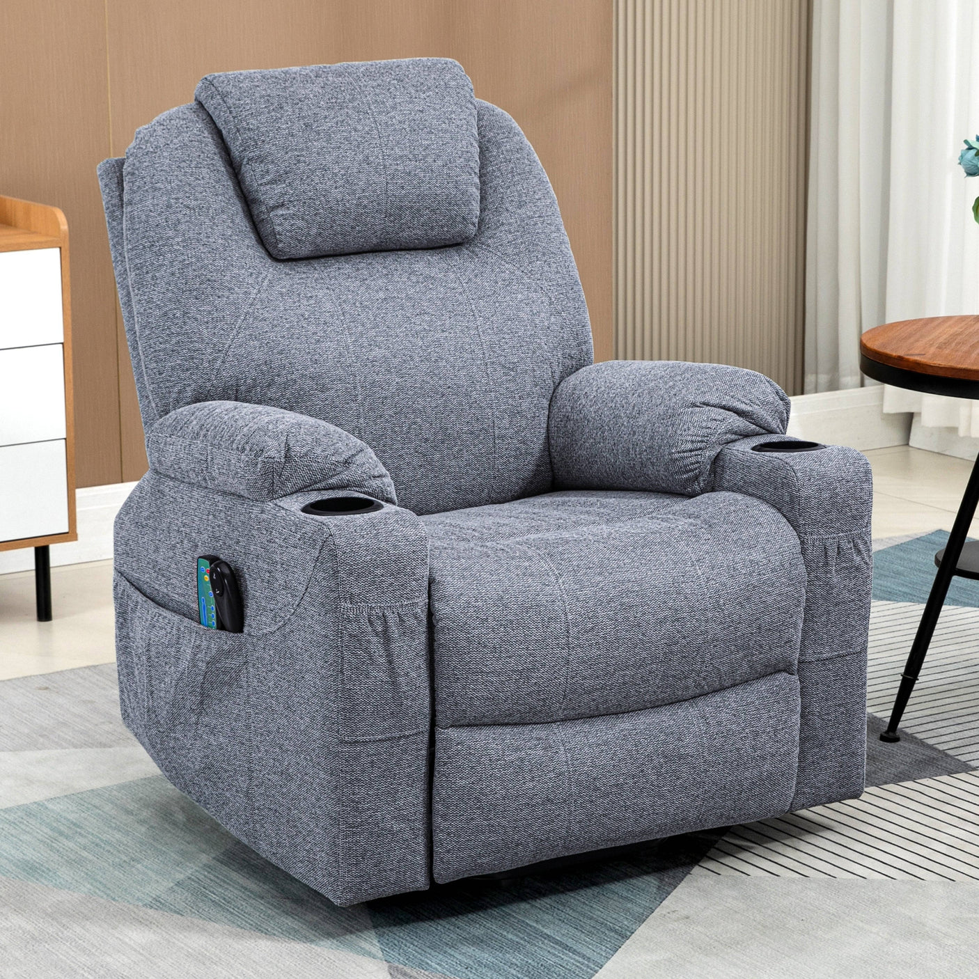 Grey electric recliner armchair with side pocket and cup holders, ideal for elderly or home theater seating.