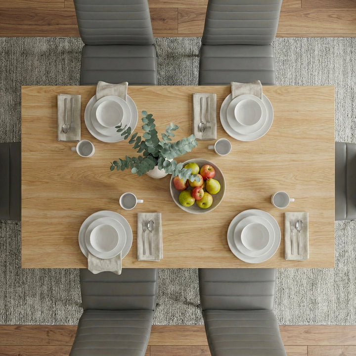 [4 Seater | Grey] Dining Table and Chairs Set seen from directly above with four place settings, linen napkins, cutlery, and a fruit and plant centrepiece