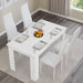 Top view of white dining table set with 4 white padded chairs, styled for modern home dining rooms.