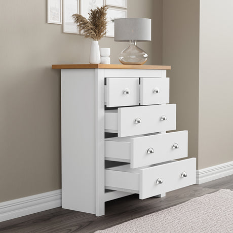 White 5 draw chest of drawers with flower pot and lamp on top modern storage for any bedroom