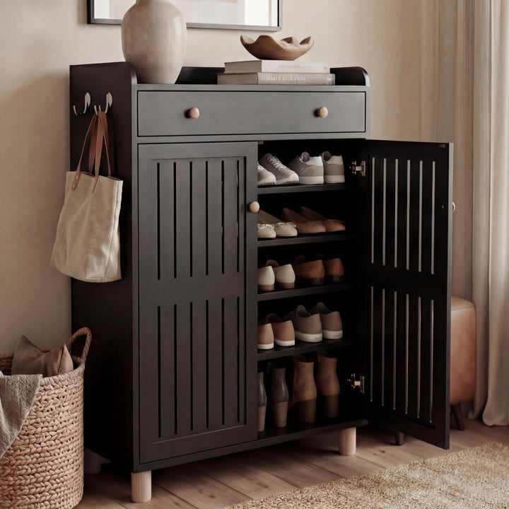[Black] Right door open revealing 5 tiers of neatly arranged shoes with left door closed in warm hallway setting