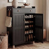 [Black] Right door open revealing 5 tiers of neatly arranged shoes with left door closed in warm hallway setting