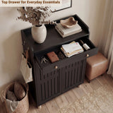 [Black] Top drawer of 5 tier shoe cabinet pulled open showing stacked books, notebooks and a leather pouch inside