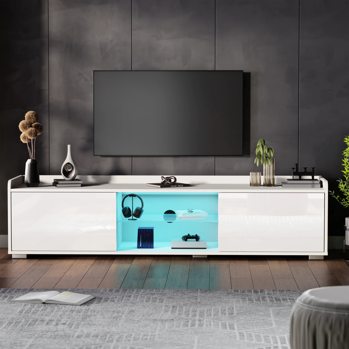 White entertainment console with blue LED lighting in a modern living room.