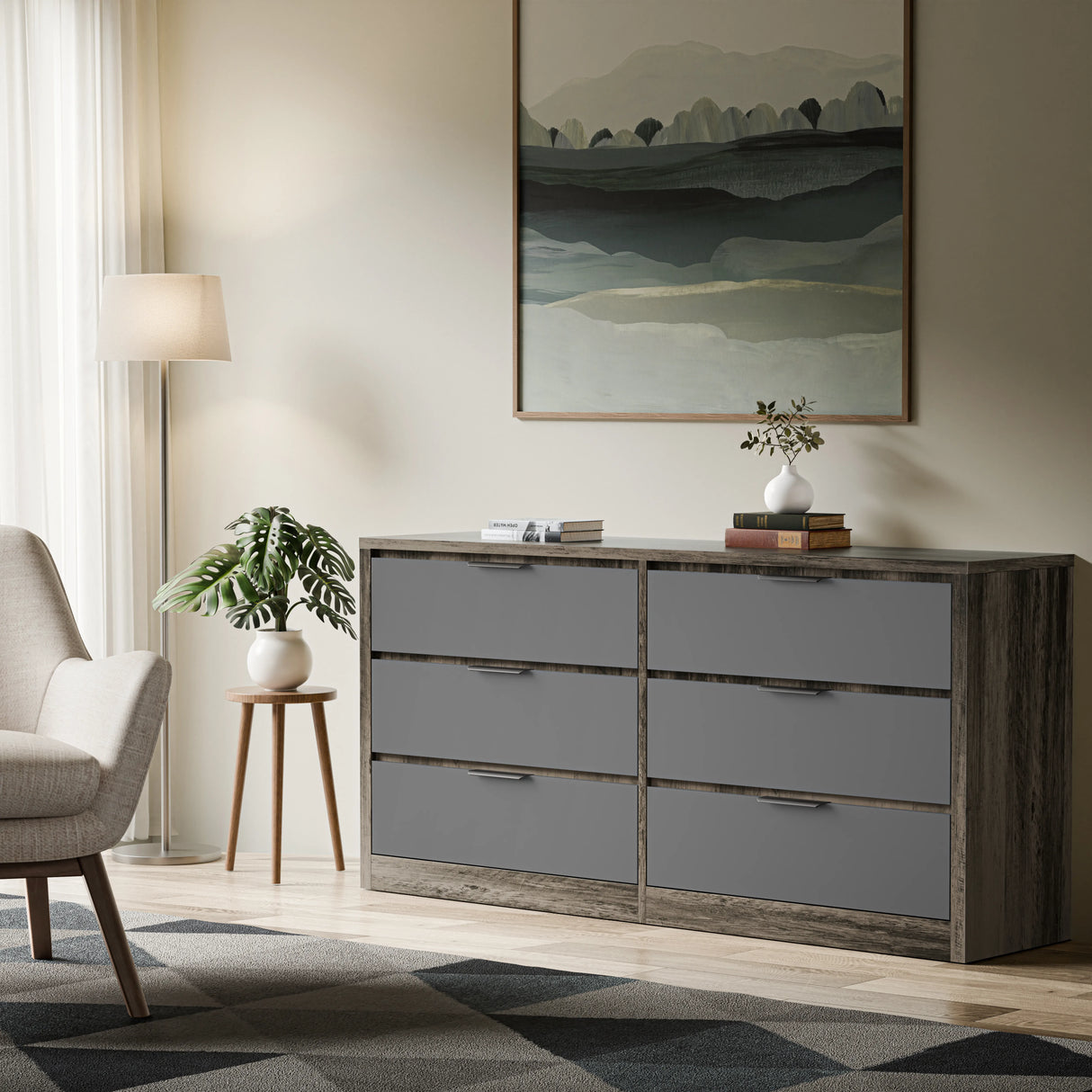 Skova 6 chest of drawers in two-tone finish positioned in a natural light room with a lamp, and decor