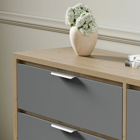 Skova 6 drawer chest of drawers placed against a wall in a bright room with a vase on top