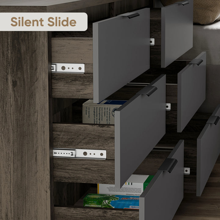 Close-up of partially open 6 drawer chest in two-tone finish, highlighting silent slide runners with metallic handles