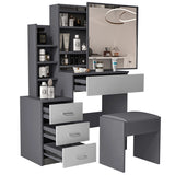 Grey vanity makeup table with light grey drawers and mirror. Features open shelving and stool for compact bedroom storage.